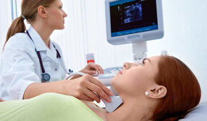 Endocrinologist-scanning-thyroid-iStock-123725720